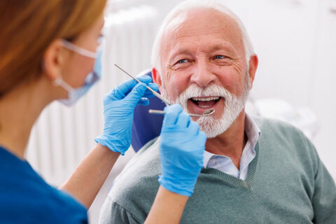 a old man getting dental treatment