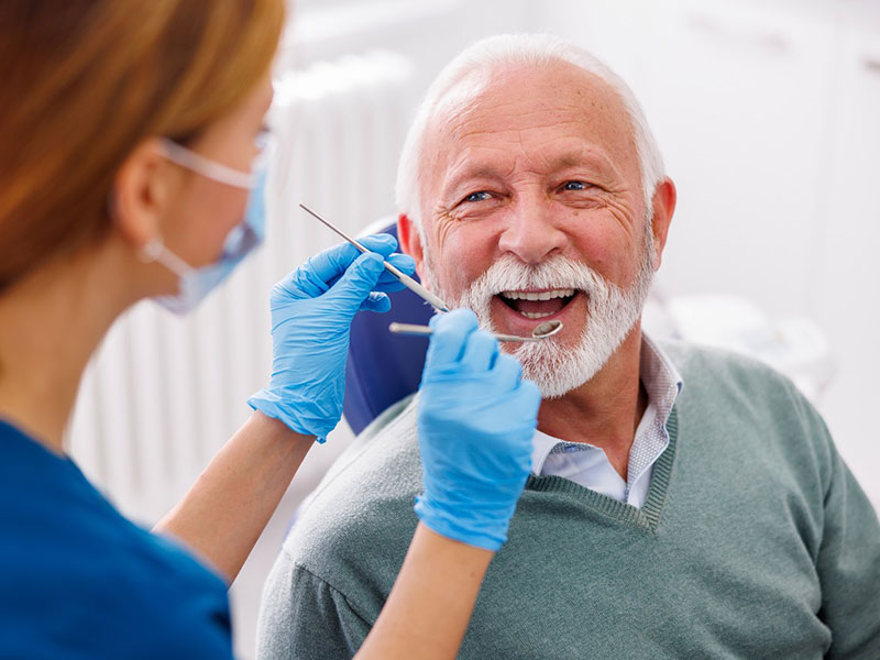 a old man getting dental treatment
