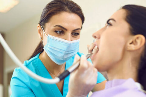 a woman getting dental treatment