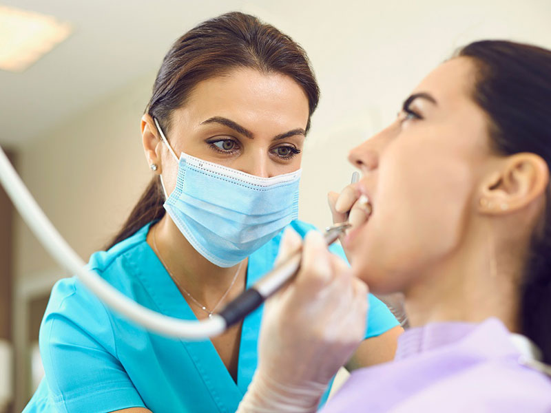 a woman getting dental treatment