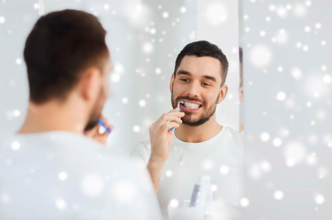 Young man brushing tooth